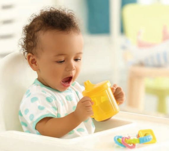 baby drinking from a cup
