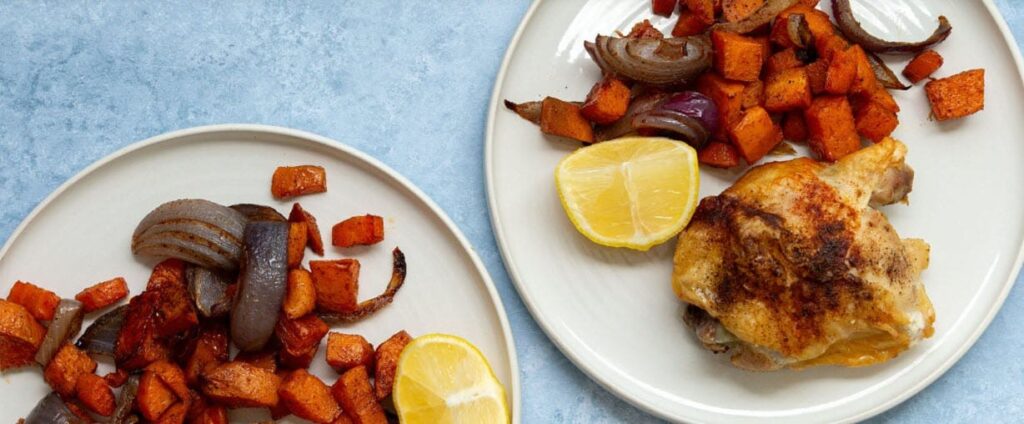Chicken and vegetables with Spices on a plate with a slice of lemon