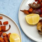 Chicken and vegetables with Spices on a plate with a slice of lemon