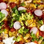 Weeknight Rotisserie Chicken & Loaded Veggie Nachos on a pan