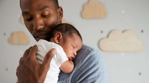 A man holding a baby