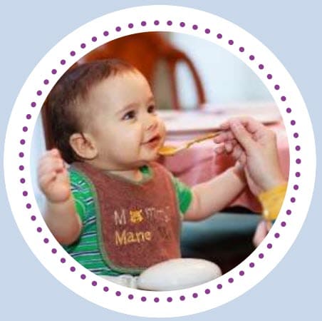 A small child eating infant cereal