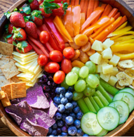 Rainbow Charcuterie Board with different colors of fruits and vegetables