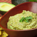 Creamy Avocado Dip in a wooden bowl