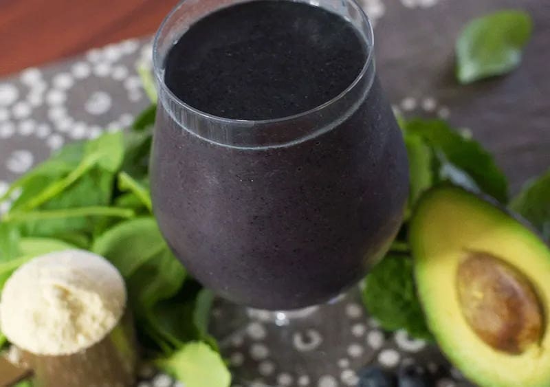 Mixed Berry Greens Smoothie with avocados on the side