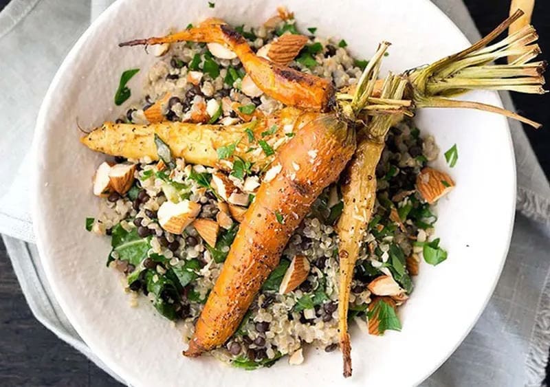 Roasted carrots and creamy quinoa in a bowl
