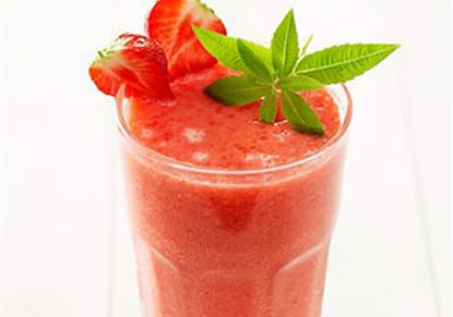 Tropical Berry Smoothie in a glass with mint and strawberries
