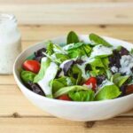 Vegan Ranch Dressing over salad in a bowl