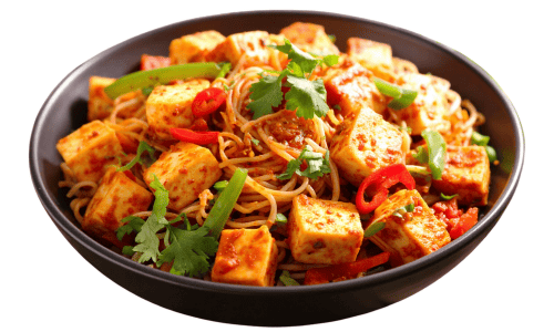 Stir fried tofu with noodles and vegetables in a bowl.