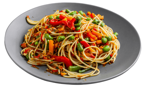 A plate of spaghetti mixed with colorful vegetables including red peppers, green beans, peas, and carrots.