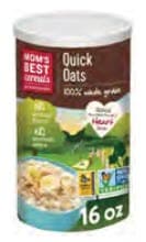 A canister of Mom’s Best quick oats with a scenic green‑hill illustration on the label.
